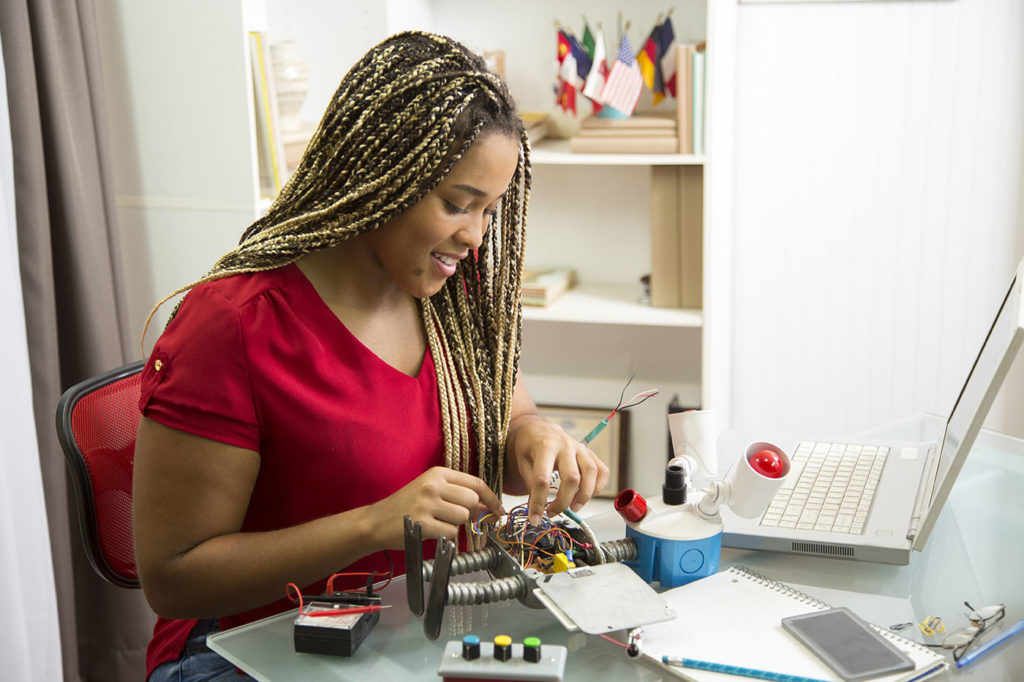 Student working on her Robot science project for school.