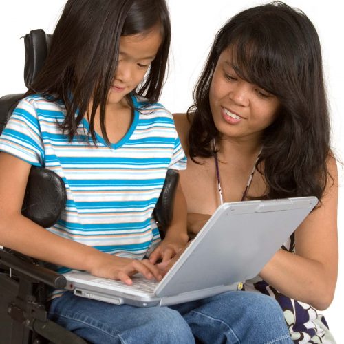 student on a computer getting help